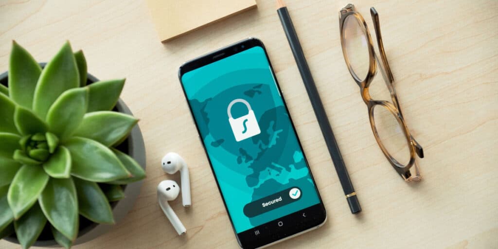 A smartphone secured with a padlock